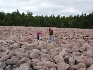 my daughter and I standing on a big pile of aggregates